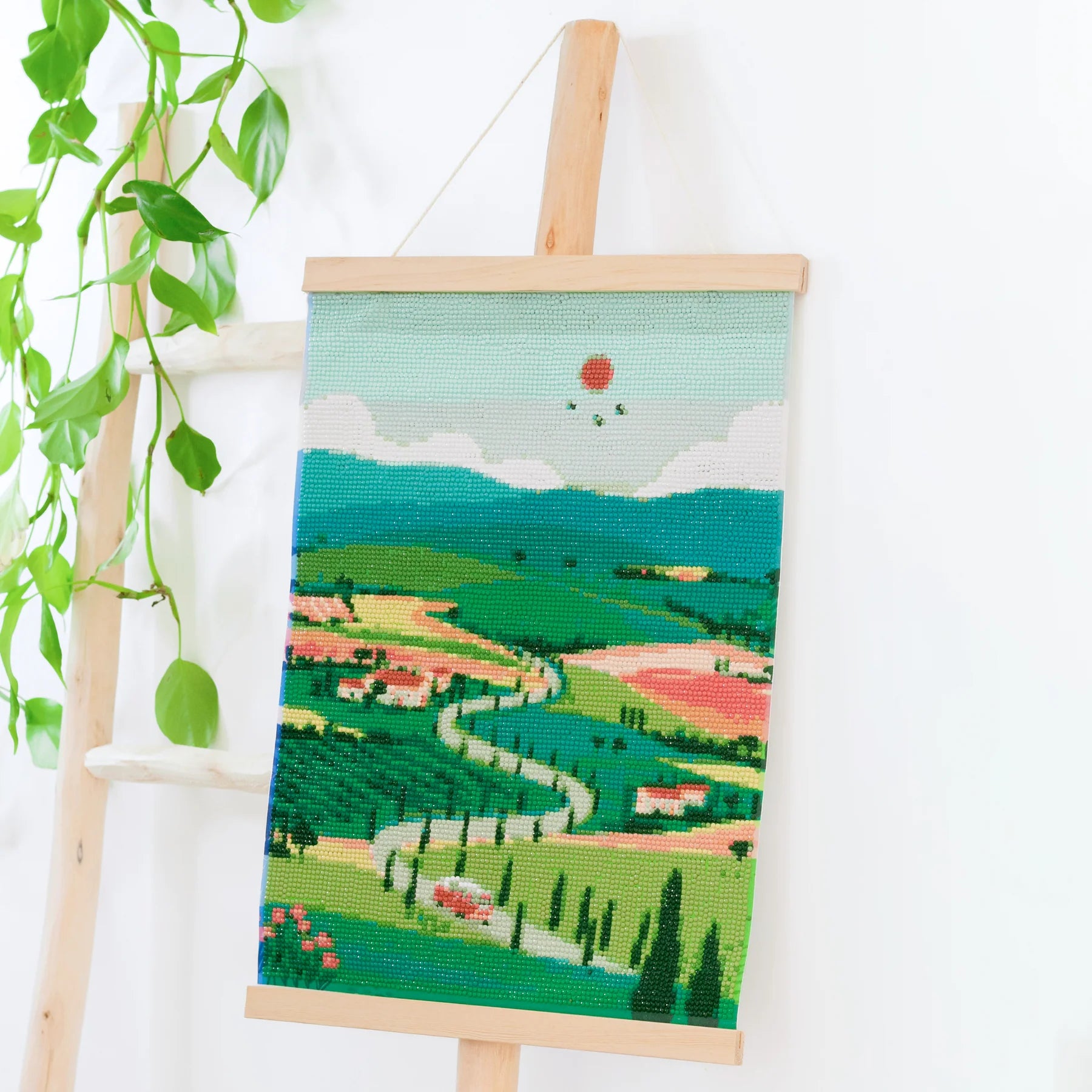 Mockup du tableau fini Diamond Painting Tuscany exposé dans un intérieur, montrant le rendu final décoratif et DIY.