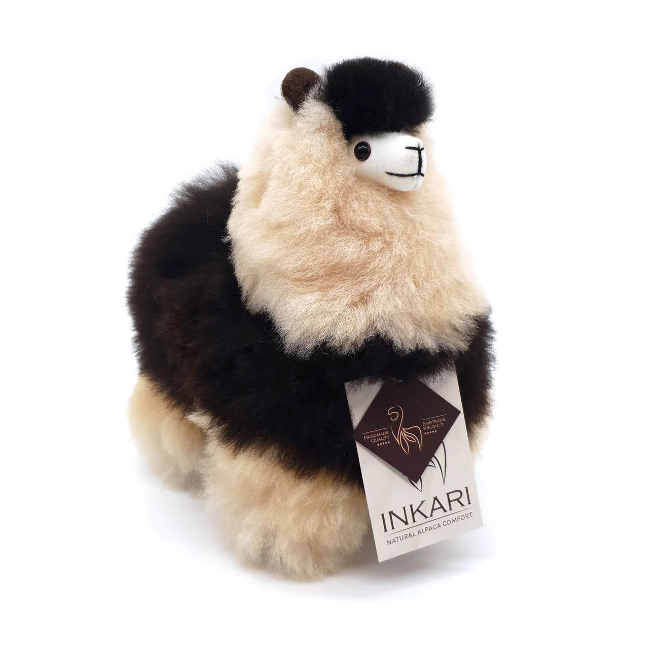 a stuffed panda bear sitting on a bench 