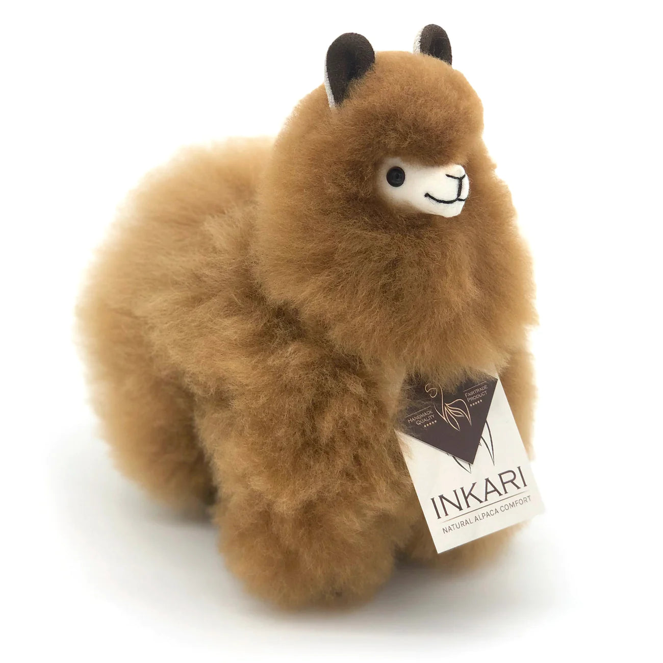 a teddy bear sitting on top of a piece of paper 